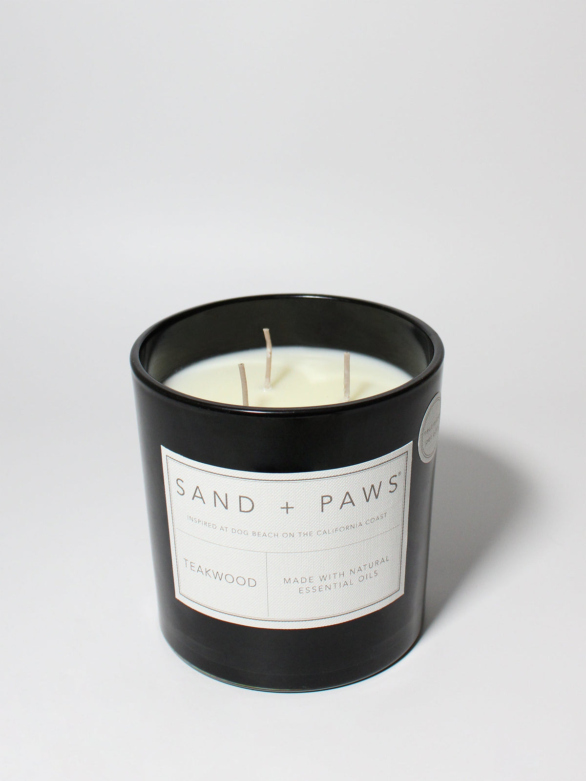 Luxurious Sand + Paws Teakwood 21 oz scented candle